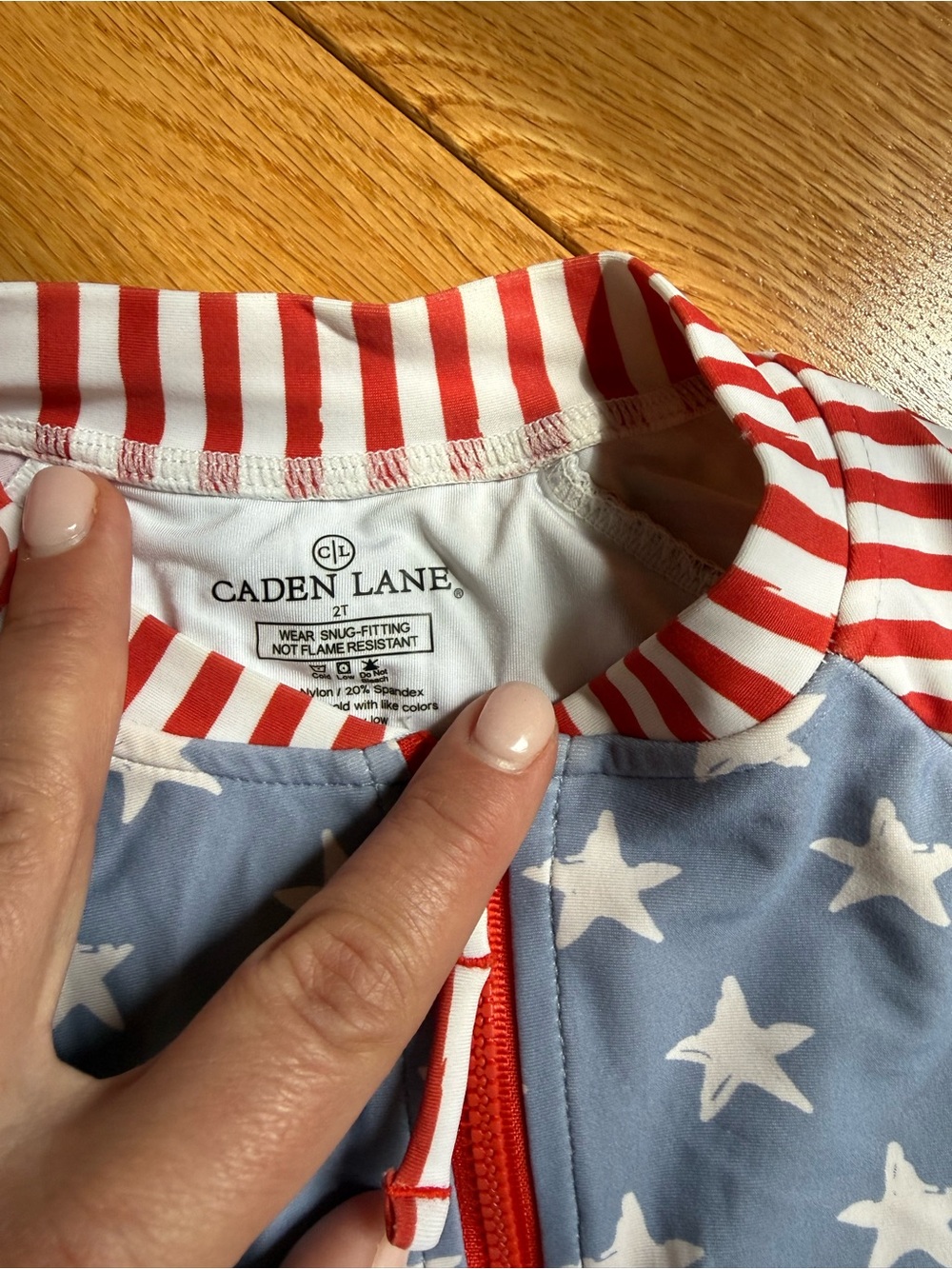 Caden Lane Blue, White & Red Star Stripe Toddler Zip Rash Guard - Picture 2 of 2